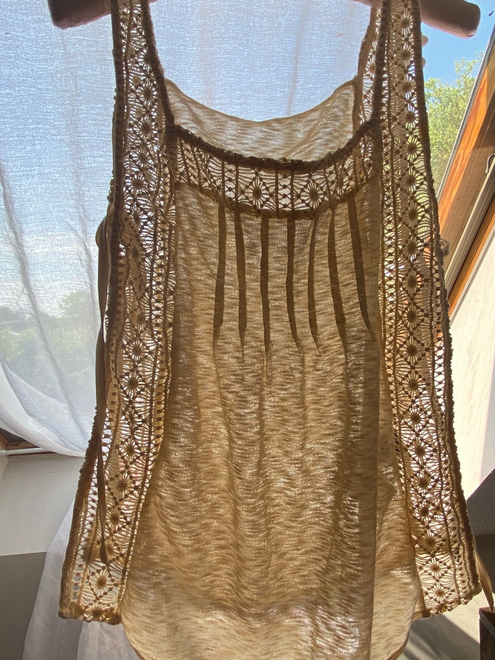 Brand new! Tan ecru bib style top. Open tie sides with knit sides. Size M